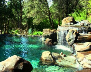 landscape-pool-design-waterfall-island-Natural-rock-swimming-pool-designs-ideas