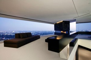 sectional-chocolate-sofa-furniture-with-bench-and-modern-fireplace-design-in-living-space-with-panoramic-view-630x420