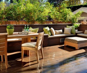 Corner-Wooden-Seating-with-Cushions-and-Plants-in-Contemporary-Patio-Design-Ideas