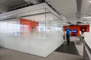 Kayak-Startup-Tech-Office-meeting-cube-with-graduated-glass-frosting-and-orange-feature-wall