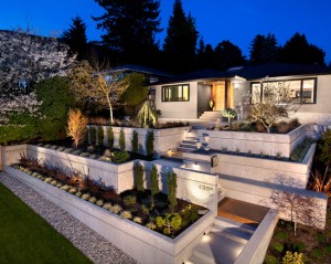 canterbury-contemporary-exterior-from-the-curbside-up-to-the-home-xtensive-retaining-walls-married-with-wooden-stair-and-landing-elements-complement-the-overall-look