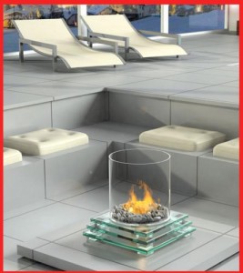 Modern-Outdoor-Fireplaces-with-circle-glass-and-grey-white-chair-and-big-window
