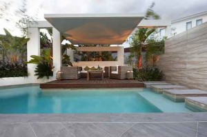 Custom-Pool-Area-covered-outdoor-lounge-patio-uplit-with-pool-stepping-platforms