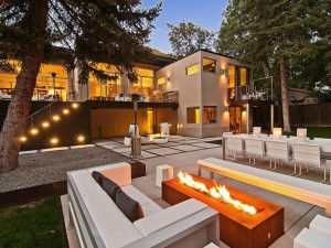 Enchanting-Patio-Design-with-Modern-Outdoor-Fireplace-and-White-Sofa