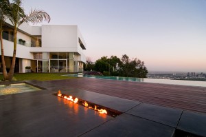 Outdoor-Pool-with-Modern-Fireplace-in-California-Luxury-Residence