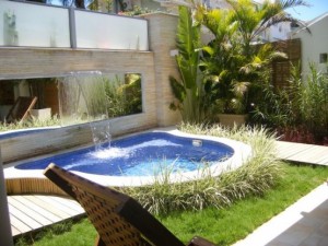 Contemporary-small-urban-backyard-garden-designs-for-small-backyard-with-deck-and-small-pool-and-concrete-wall